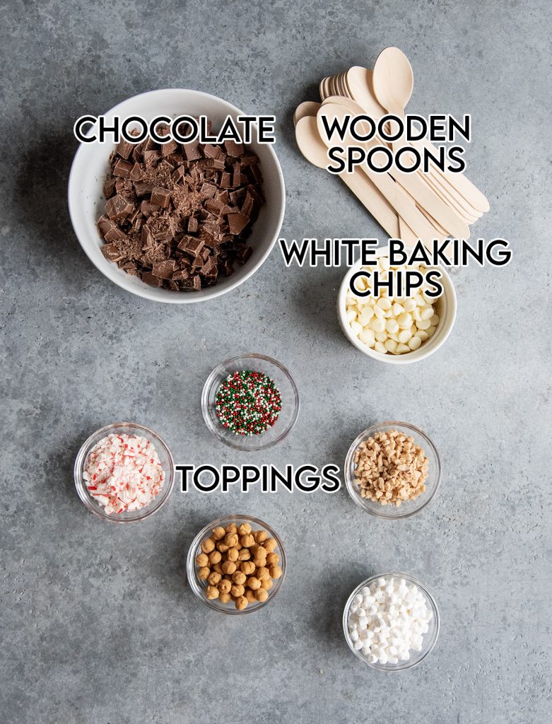 An overhead photo of the ingredients needed to make hot chocolate spoons.