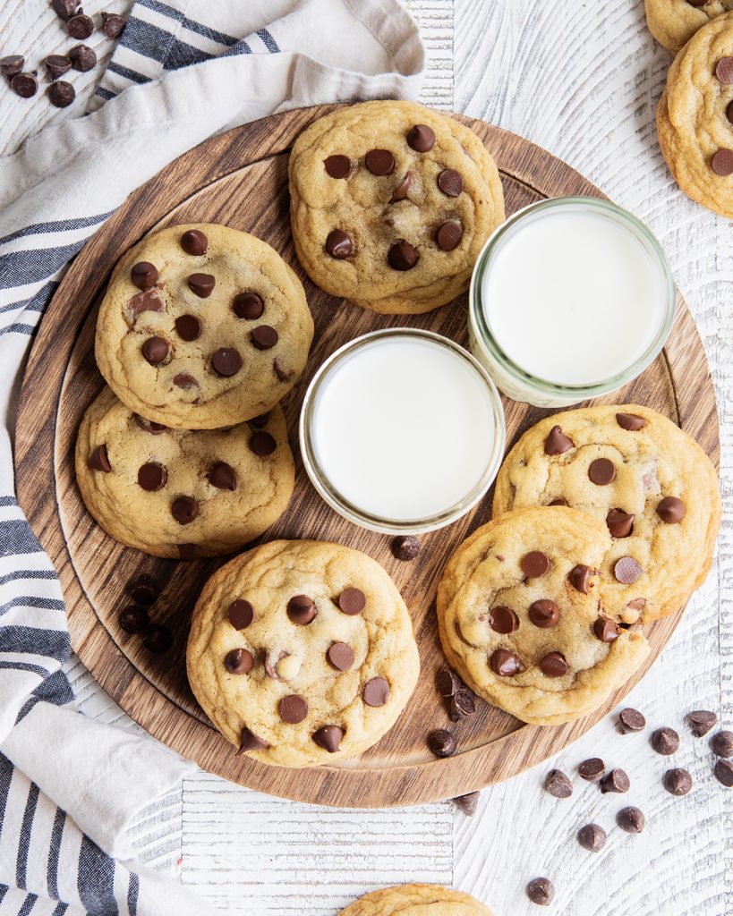 An overhead photo of a tray of cookies and milk.