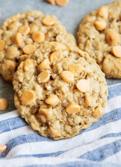 A close up of a pile of oatmeal butterscotch cookies.