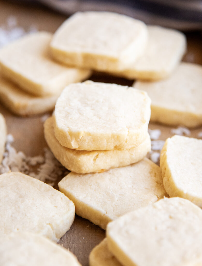 A pile of square coconut cookies. 