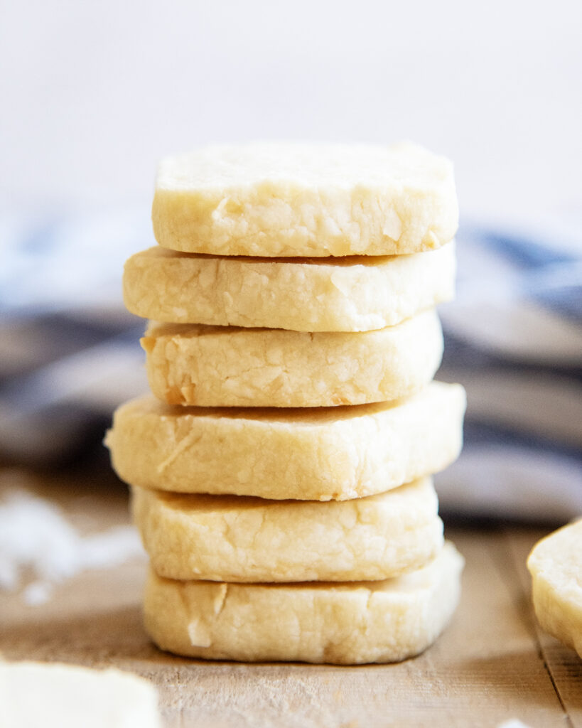 A stack of 6 square shortbread cookies taken from the front.