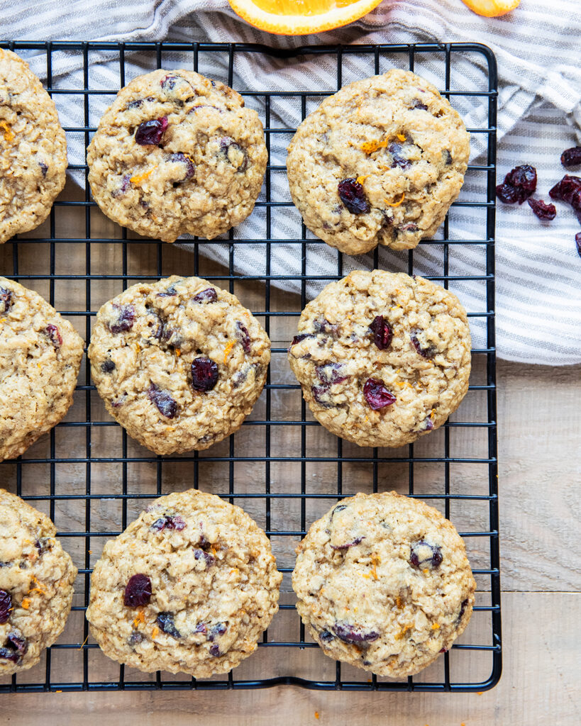 An overhead photo of cranberry orange oatmeal cookies on a cooling rack.