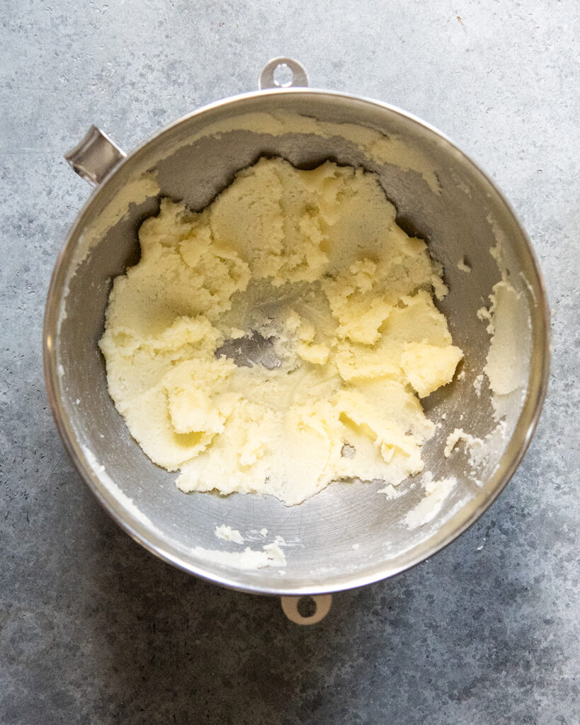 A bowl of creamed butter and sugar.