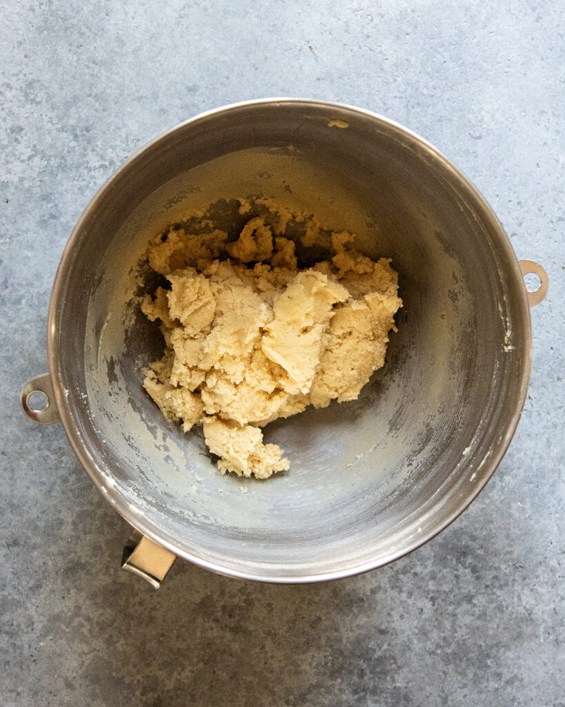 Sugar cookie dough in a mixing bowl.