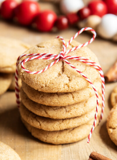 A stack of 5 snickerdoodle cookies tied with a red and white twine.