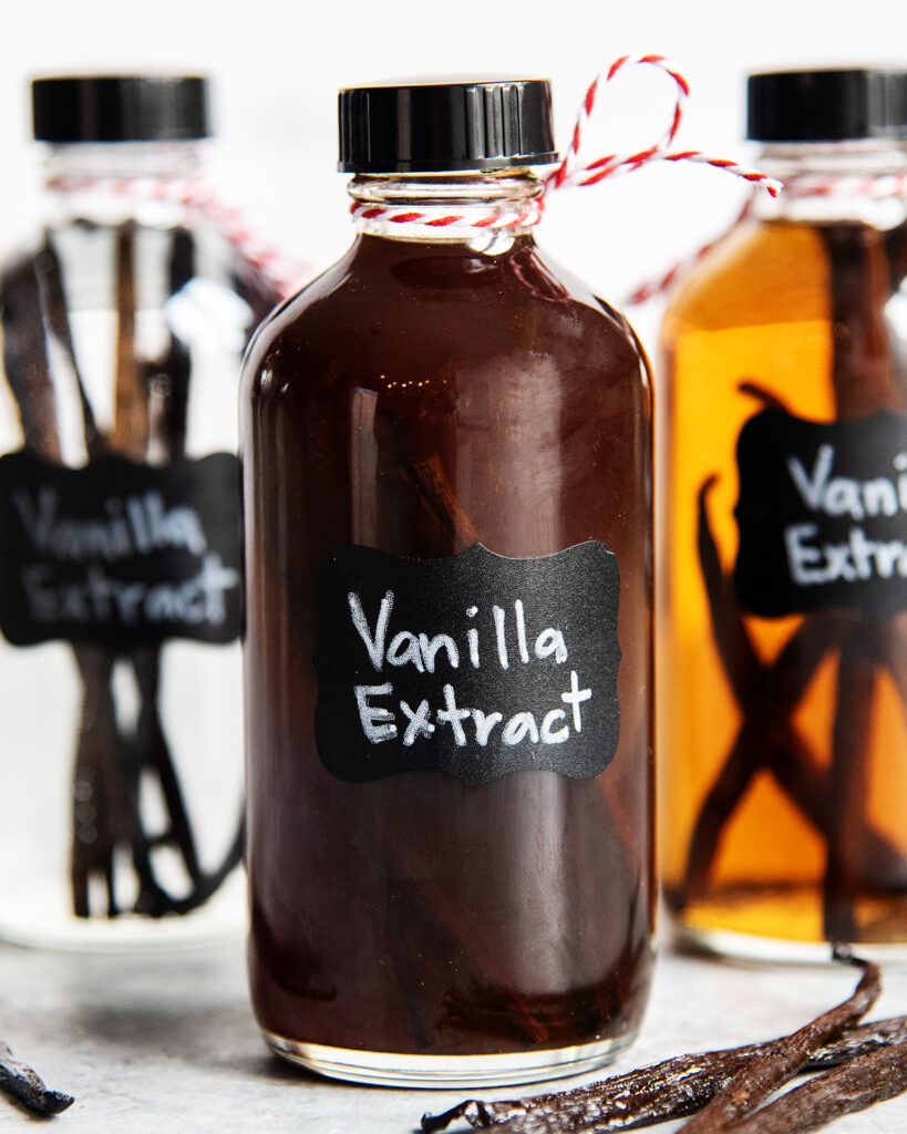A bottle with a brown liquid, labeled vanilla extract.