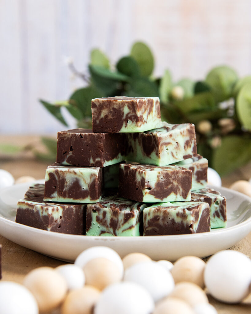 A stack of Chocolate and Mint Swirled fudge on a white plate.