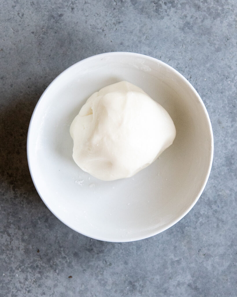 A bowl of powdered sugar fondant. 