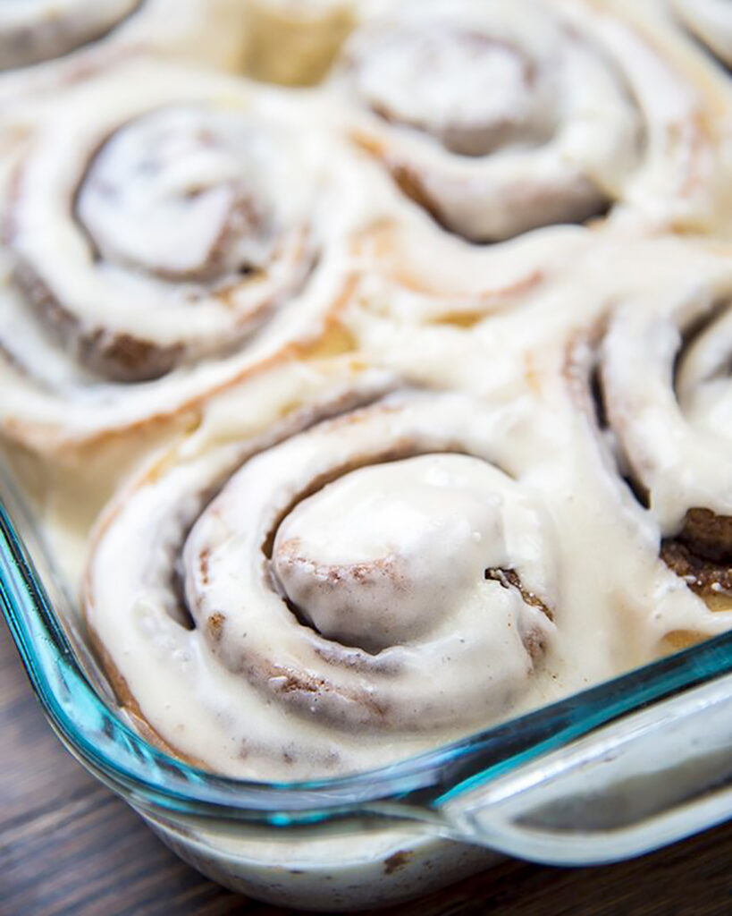 A glass pan of eggnog cinnamon rolls.