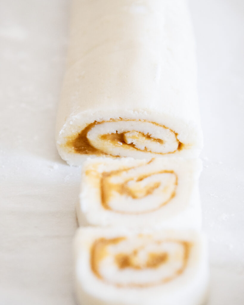 Rolled up potato candy with slices of it cut off in the front.