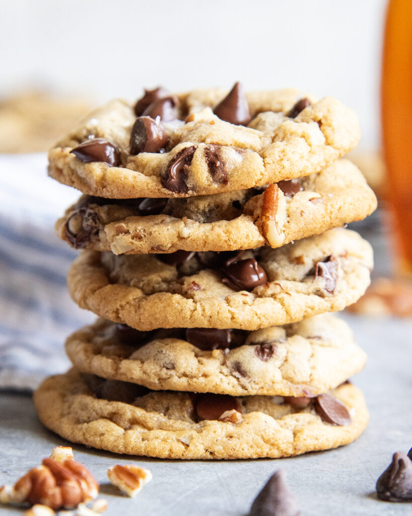 A stack of 5 maple chocolate chip cookies.