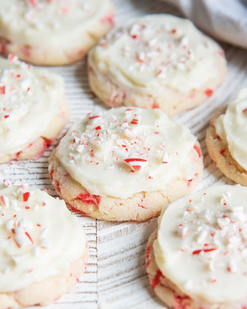 Peppermint Sugar cookies topped with icing and candy cane pieces.