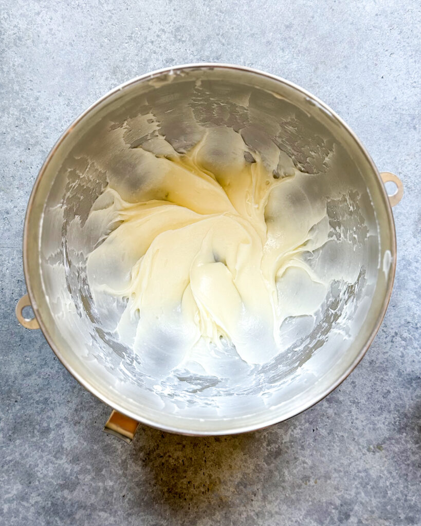 A bowl of butter and cream cheese mixed together.