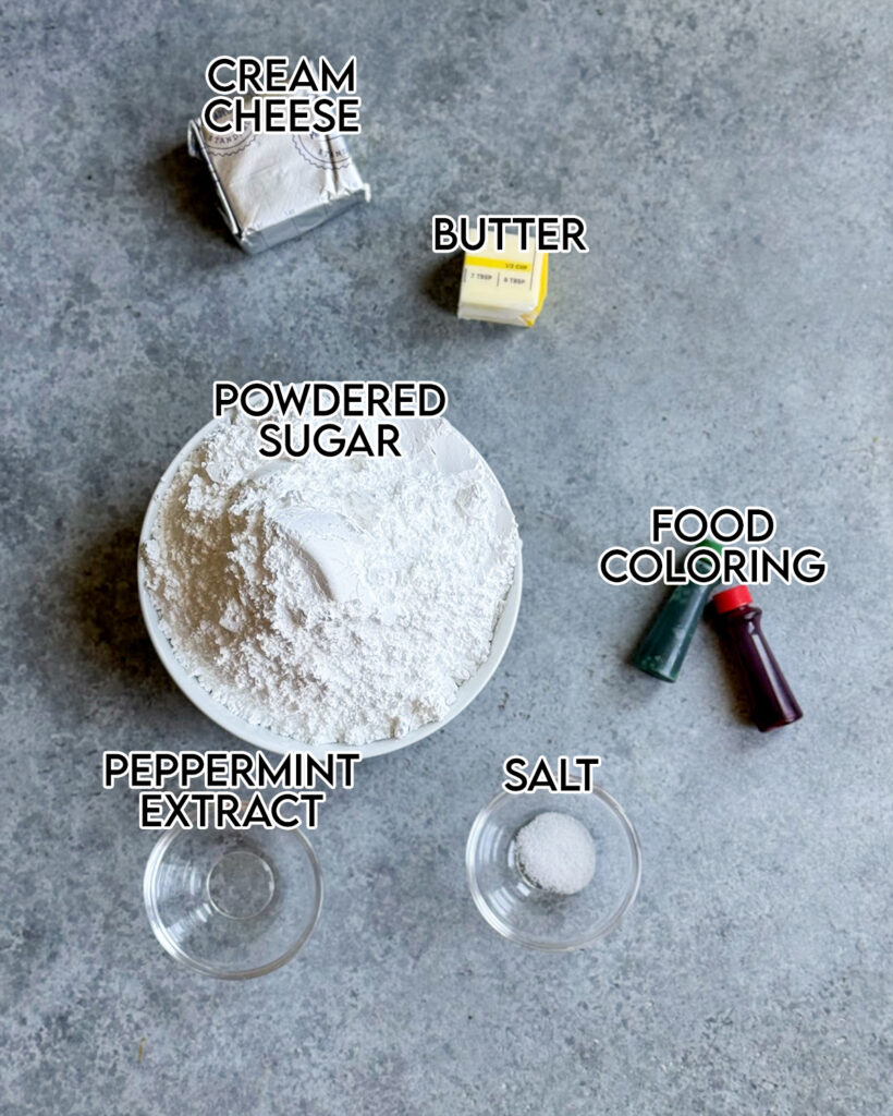 The ingredients needed to make cream cheese mints, including half a block of cream cheese, some butter, powdered sugar, and food coloring.