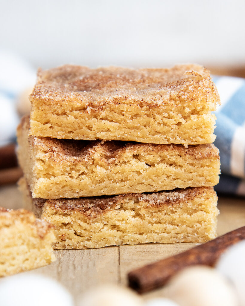 A stack of three snickerdoodle cookie bars. 