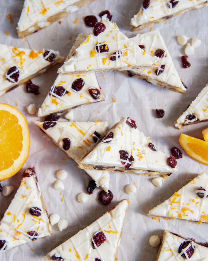 An above view of homemade white chocolate cranberry cookie bars.