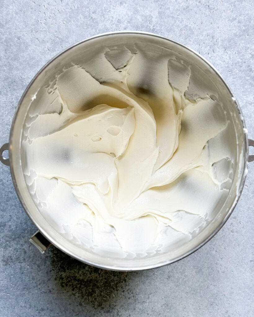 A bowl of cream cheese frosting.