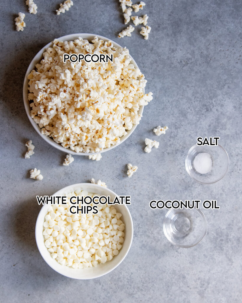 Bowls of the four ingredients needed to make white chocolate popcorn.