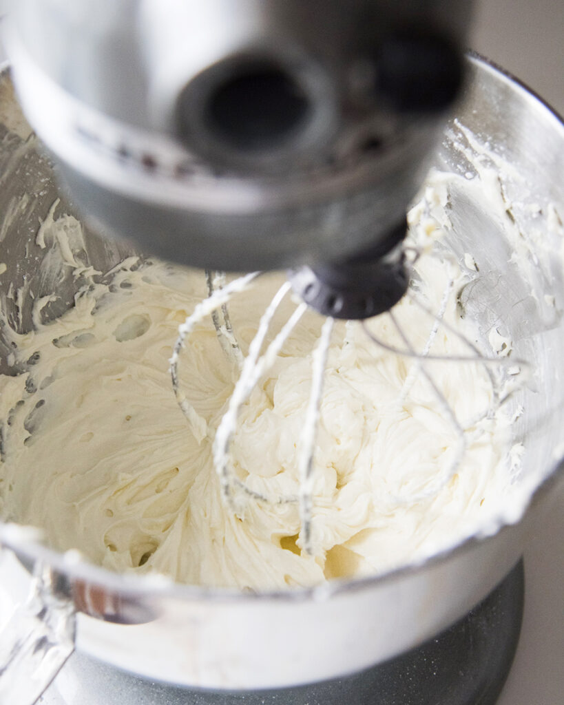 A mixing bowl of buttercream frosting. 