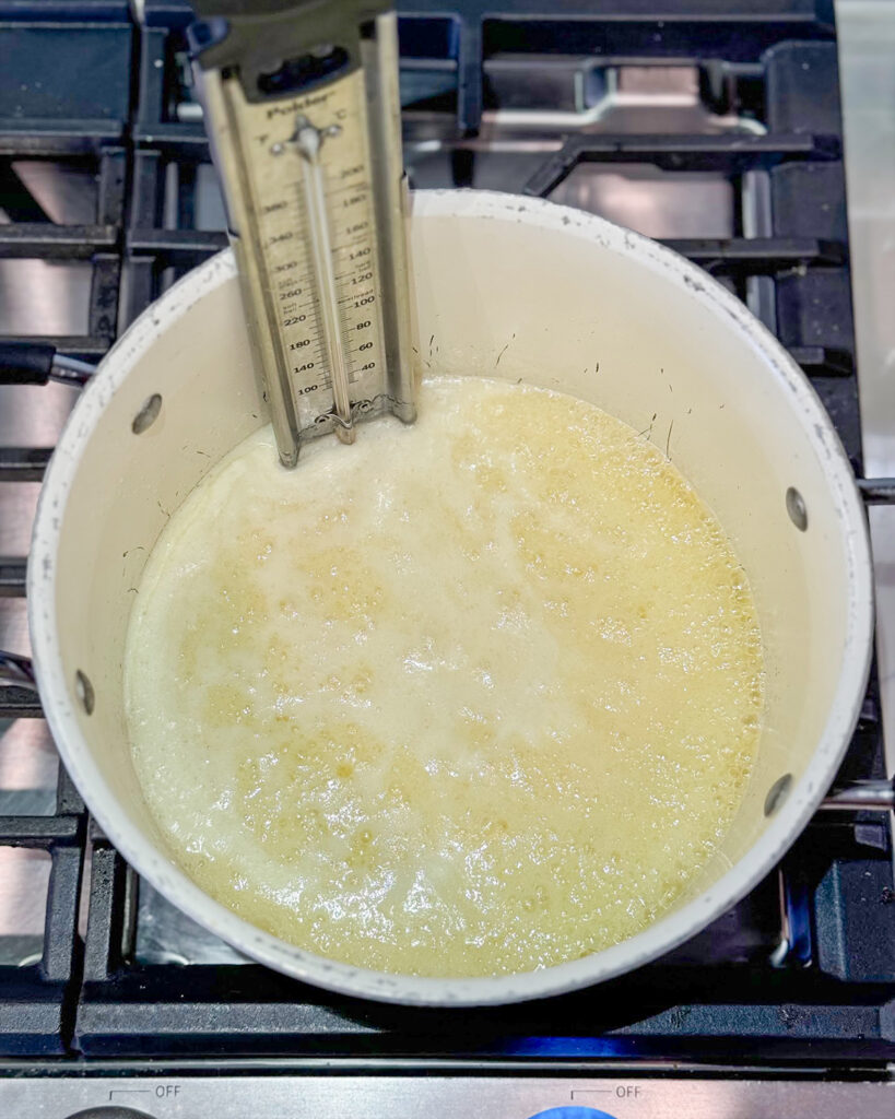 A pot of melted sugar and butter bubbling in a pot.