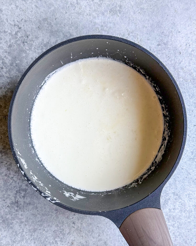 A pot of simmering heavy cream.