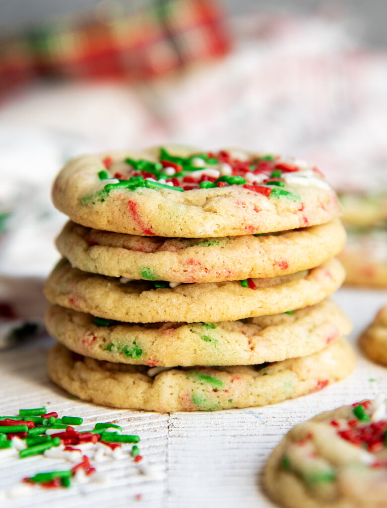 A stack of 5 Christmas Funfetti cookies with red, white, and green sprinkles.