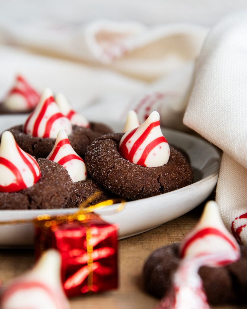 A plate of chocolate blossom cookies topped with Peppermint Kisses.