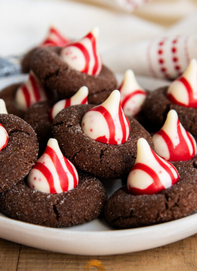 A plate of chocolate blossom cookies topped with Peppermint Kisses.