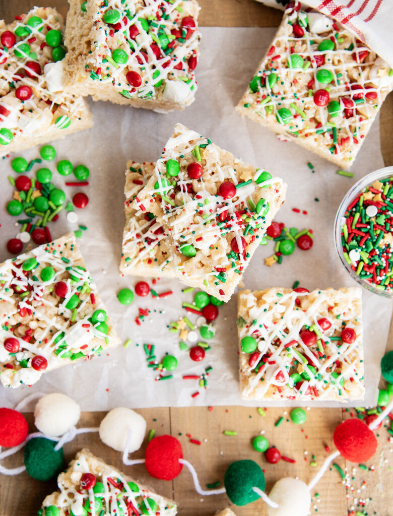 An above view of Christmas rice krispie treats on a piece of parchment paper.