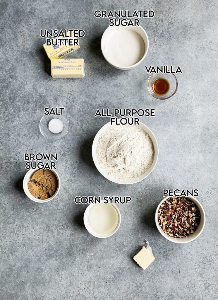 Bowls of the ingredients needed to make pecan pie thumbprint cookies.