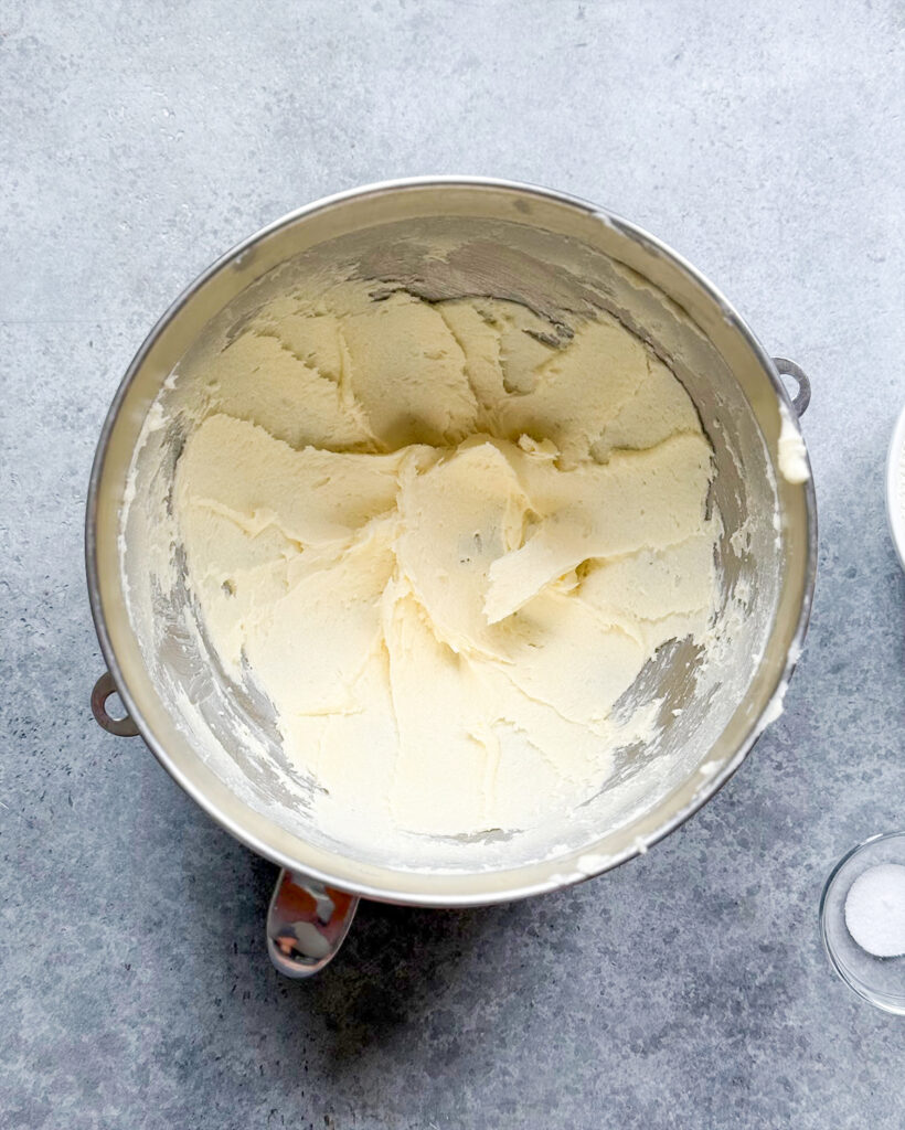 Creamed butter and sugar in a metal bowl.