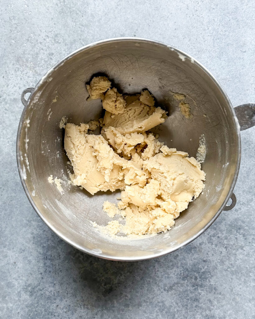 Shortbread cookie dough in a mixing bowl.