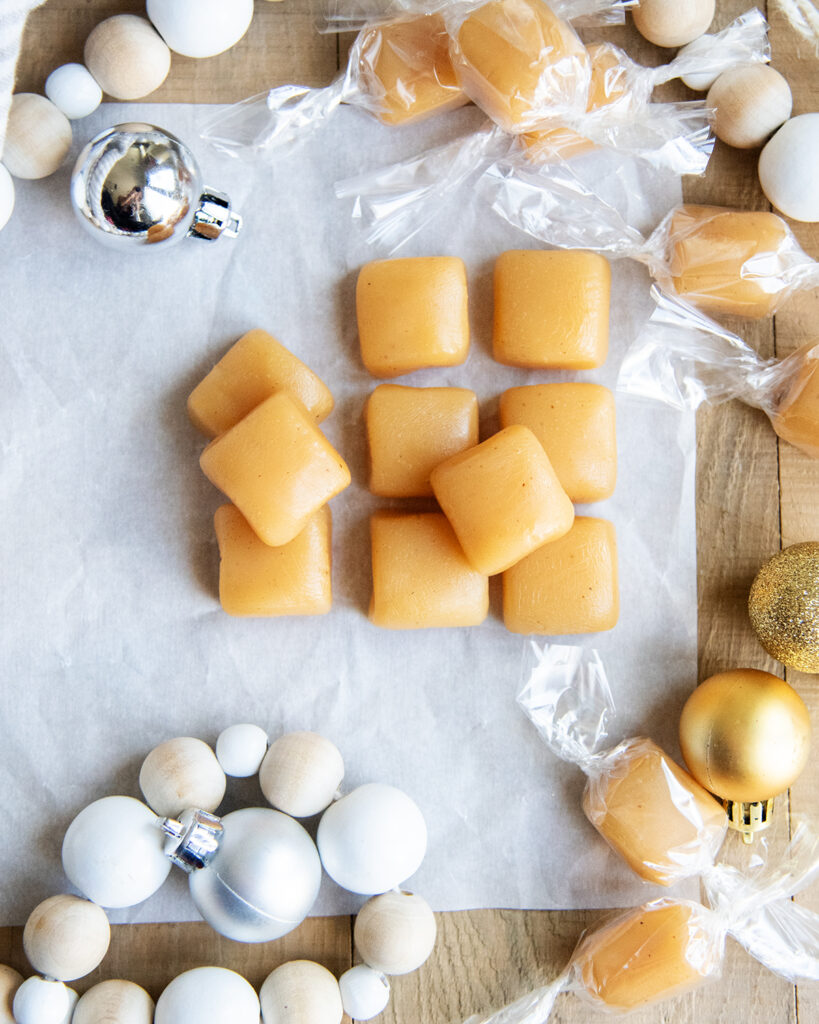 An above view of eggnog caramel squares in a pile.