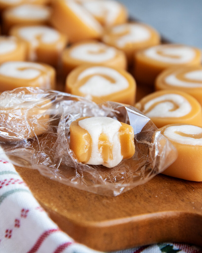 A vanilla cream filled caramel with a bite out of it.