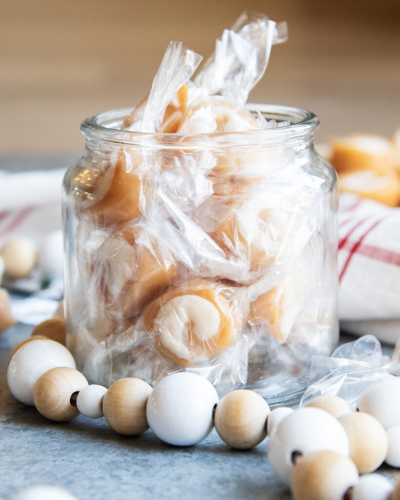 A jar of packaged vanilla caramel creams.