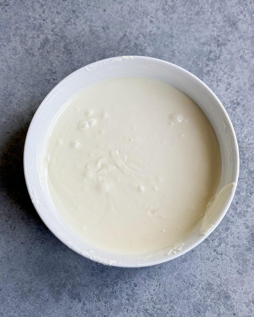 A bowl of melted white chocolate.