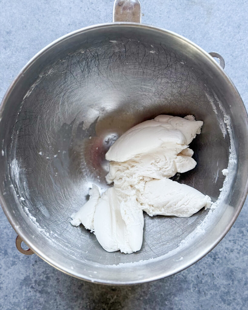 A vanilla cream filling in a silver mixing bowl.