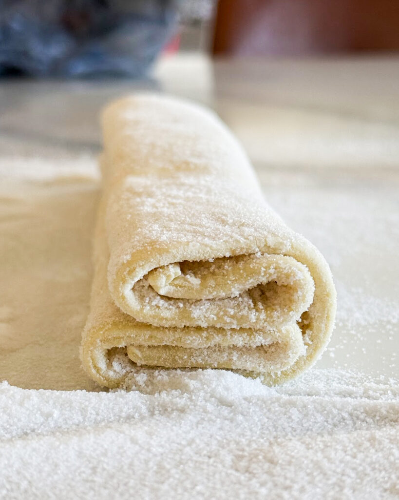 Puff pastry rolled into sixths to make palmiers. 