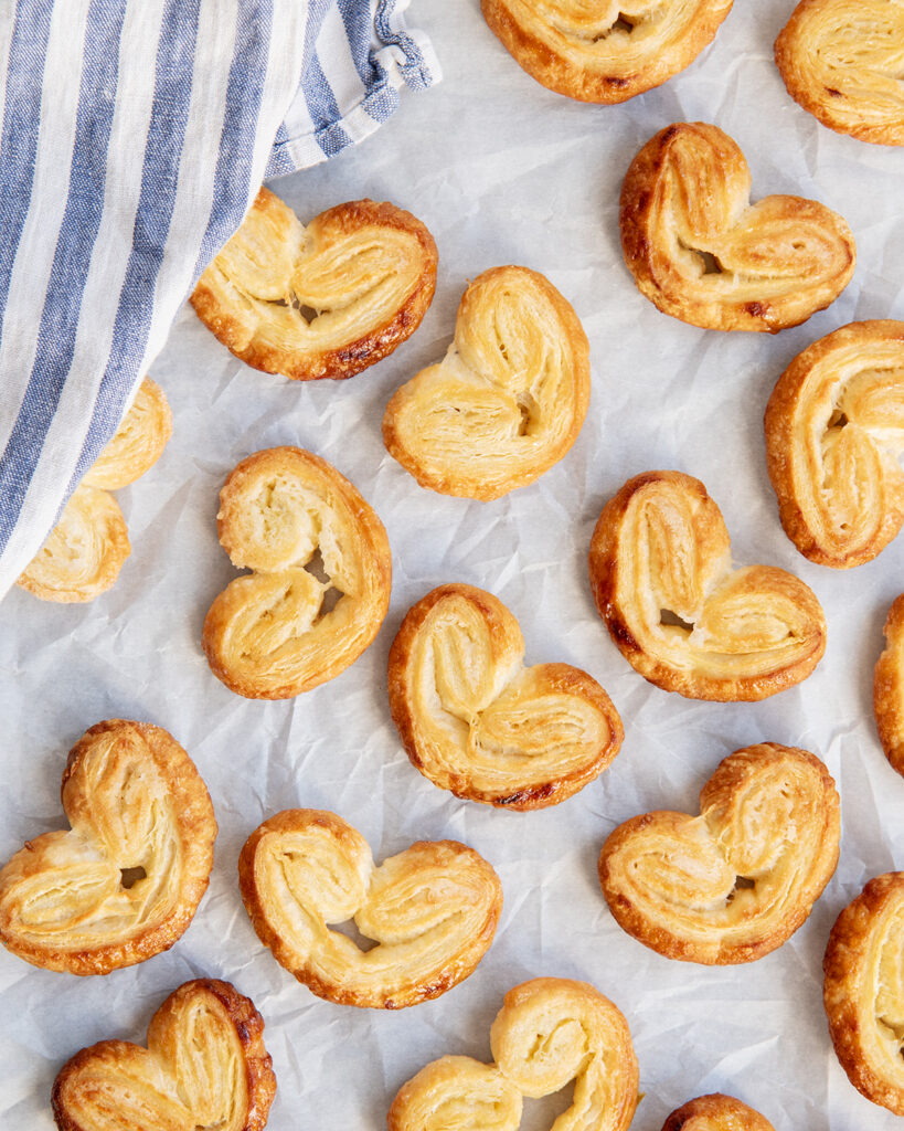 Heart Shaped Palmier Pastries on a white piece of parchment paper.