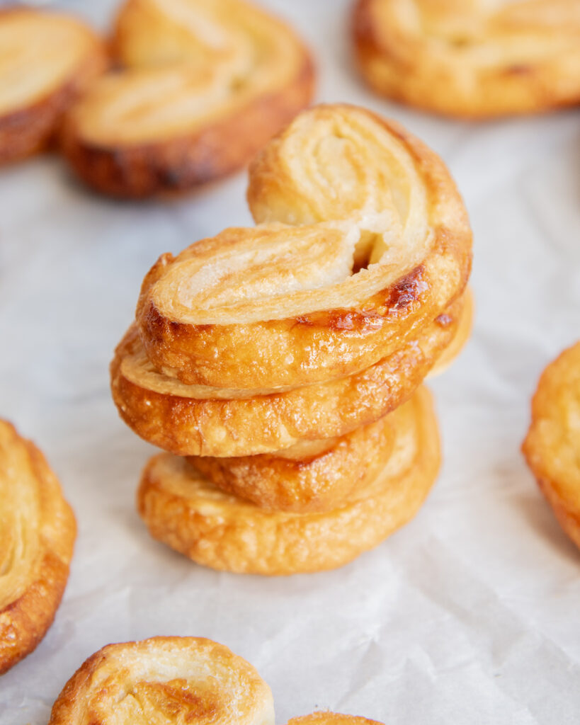 A stack of 4 heart shaped palmiers.