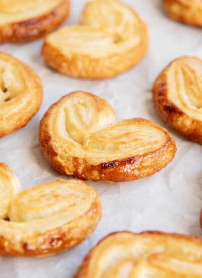 Heart Shaped Palmier Pastries on a white piece of parchment paper.