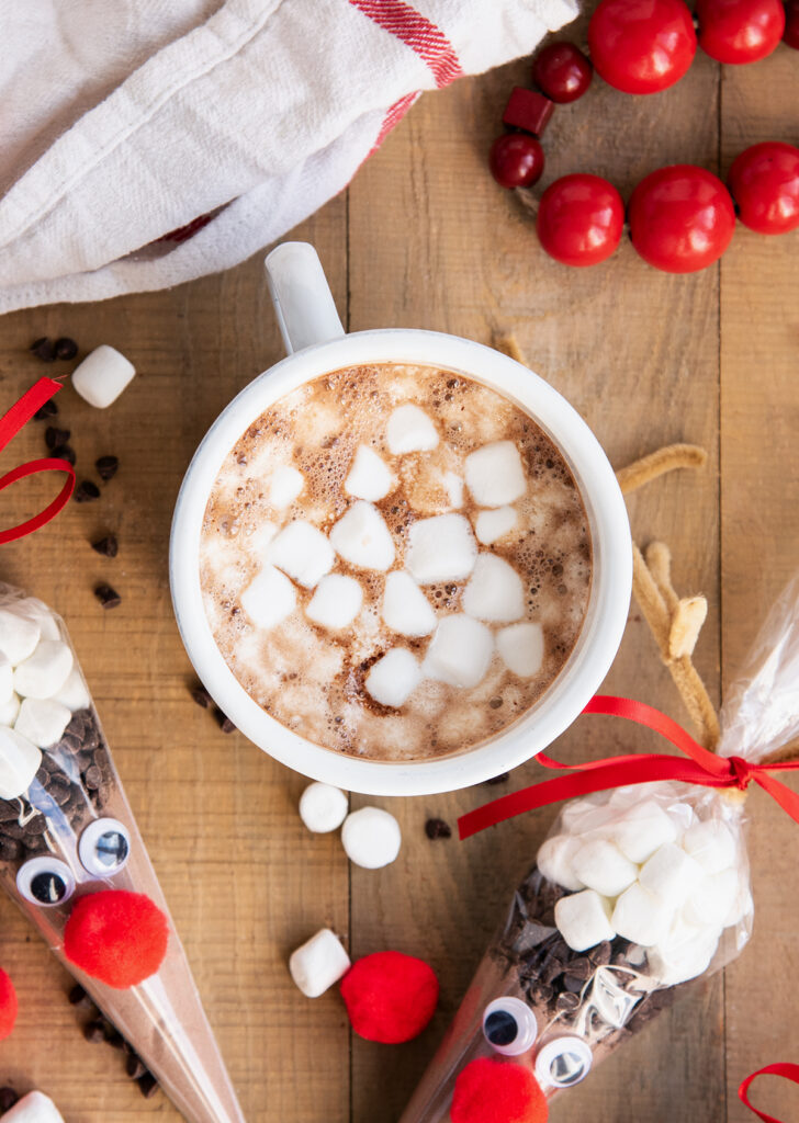 A mug of hot chocolate topped with mini marshmallows.