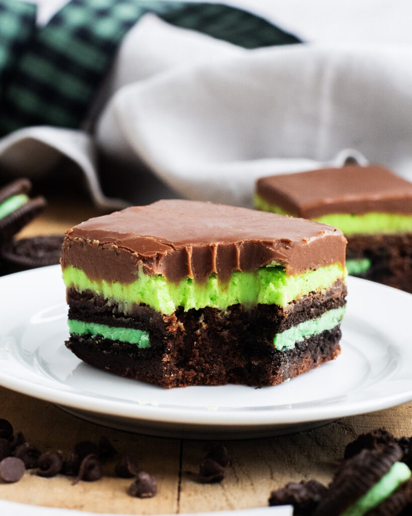 A mint oreo brownie with a bite out of it.