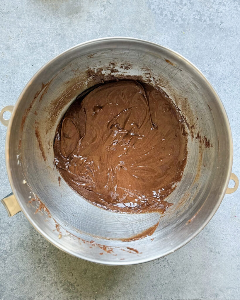 Brownie batter in a metal bowl.