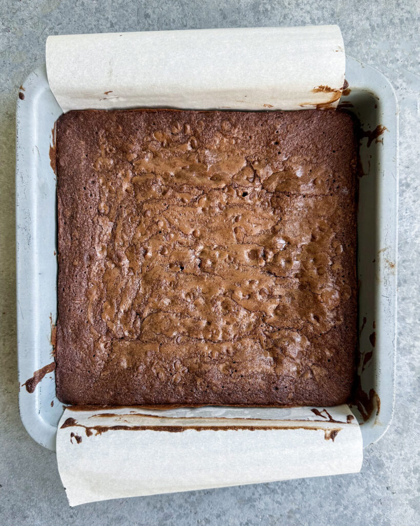 An above view of a pan of baked brownies. 