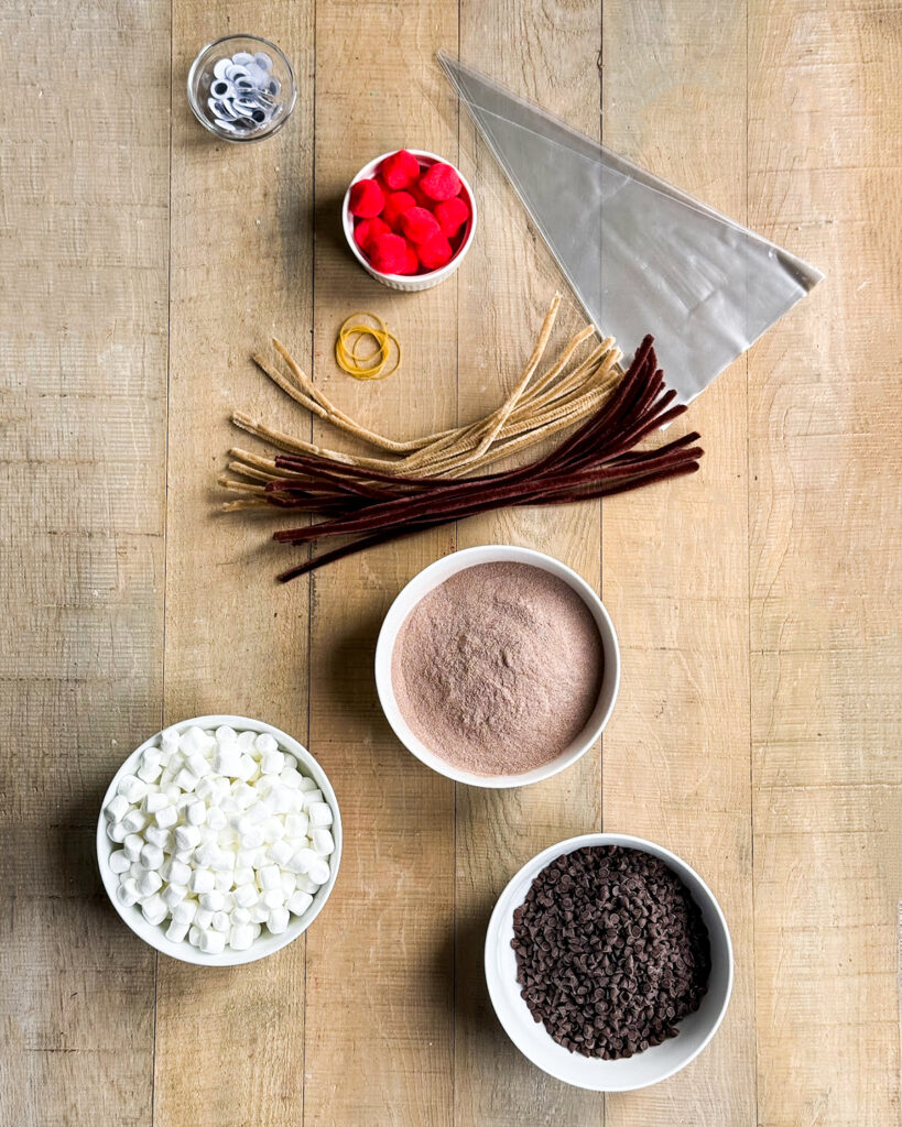 The ingredients and supplies needed  to make reindeer hot chocolate.