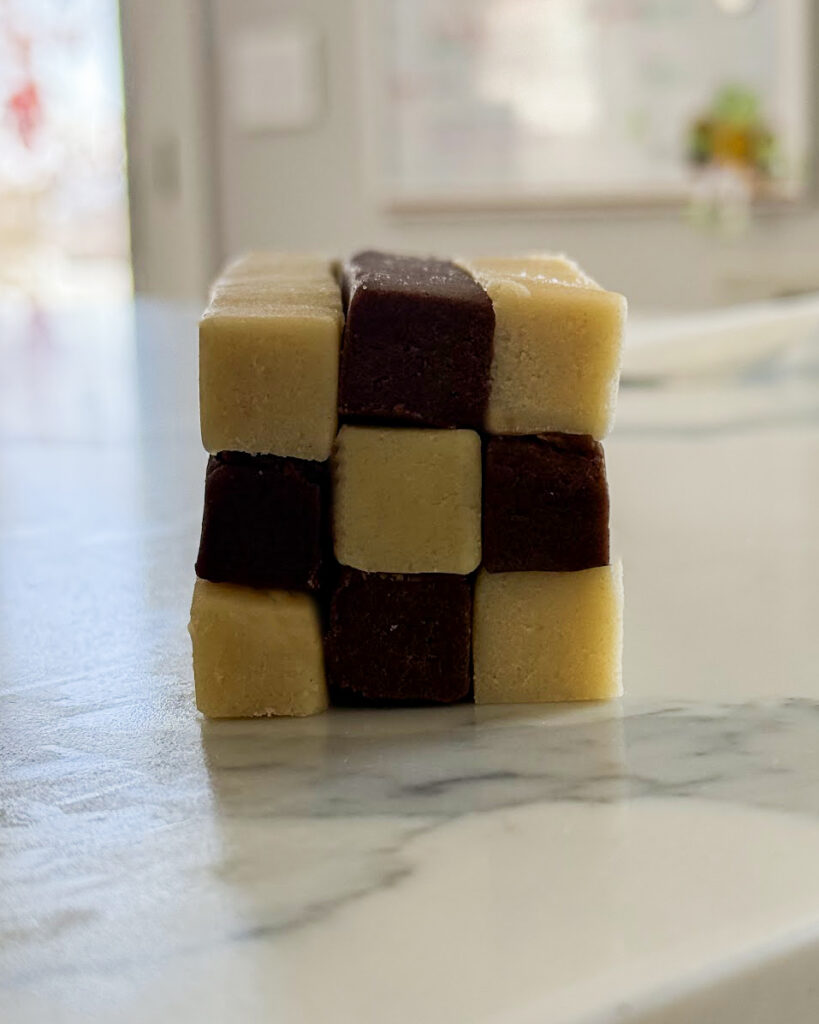 A side view of checkerboard cookies with the slices of dough layered together.