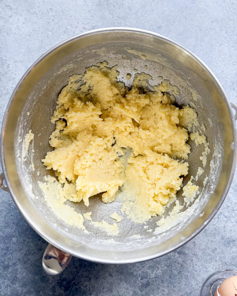 A bowl of the wet ingredients needed to make lemon poppy seed cookies. 