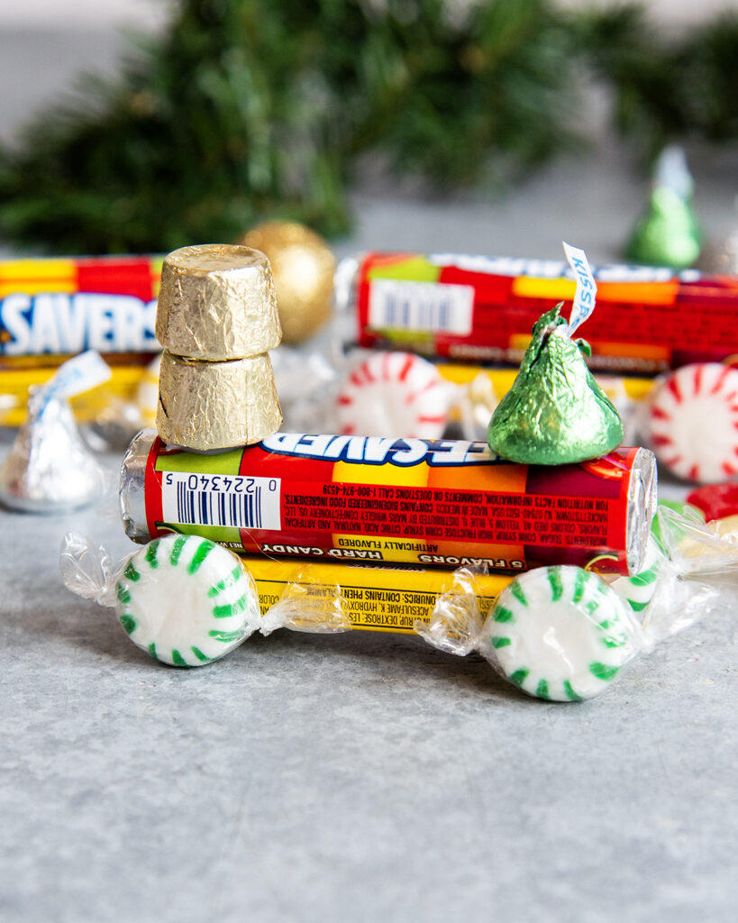 A candy train made with life savers, mints, rolos, and hershey kisses.