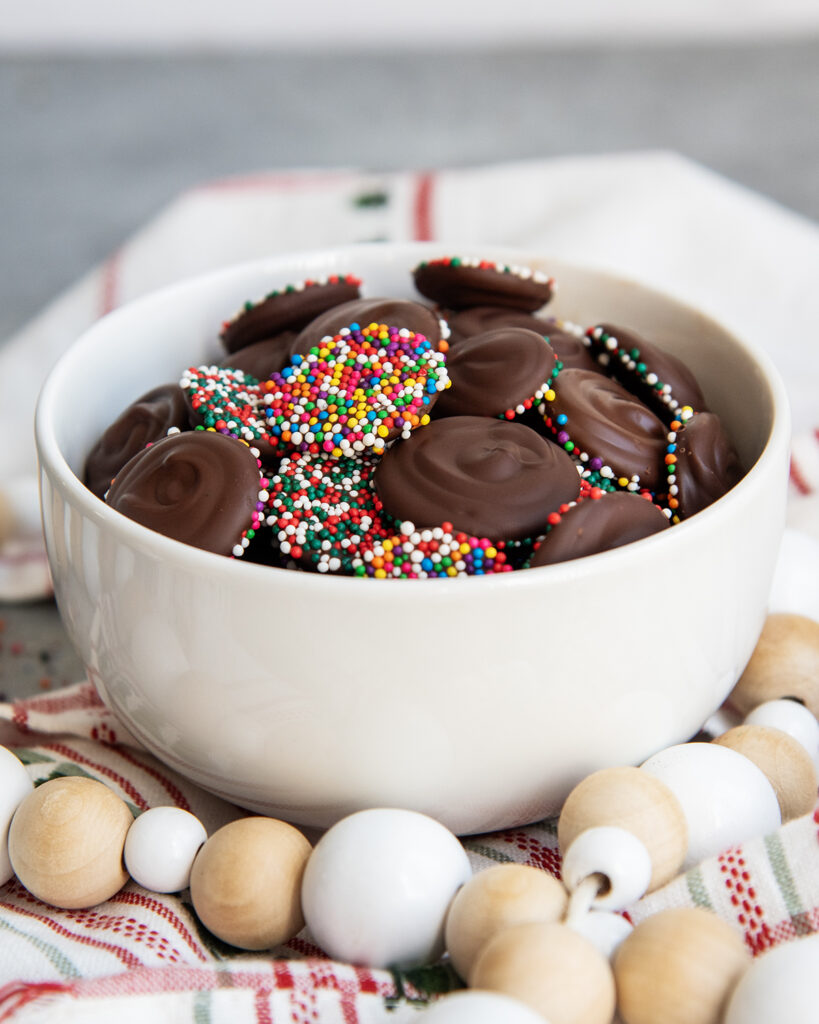 Chocolate Nonpareils in a small white bowl.